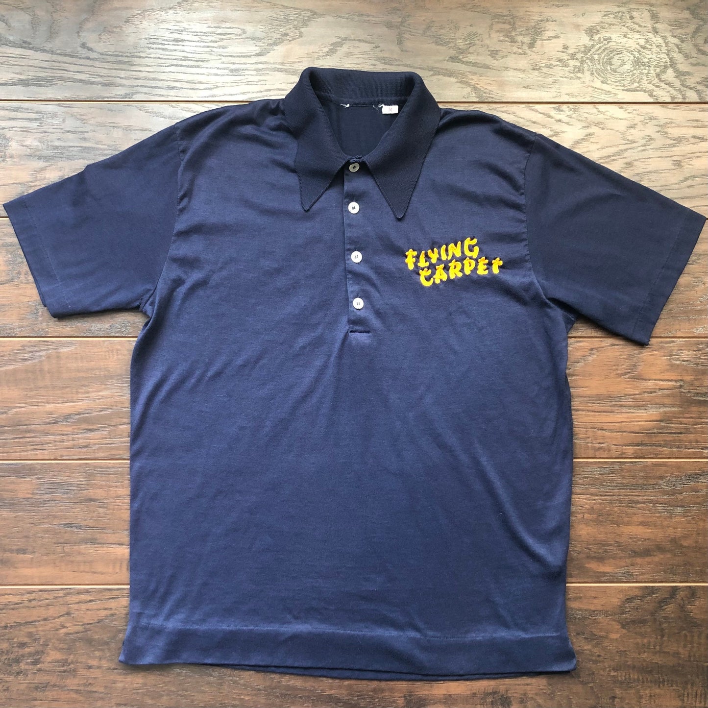 Vintage Unisex Embroidered Flying Carpet Four Buttoned Polo | Possibly Flying Carpet Motor Inn