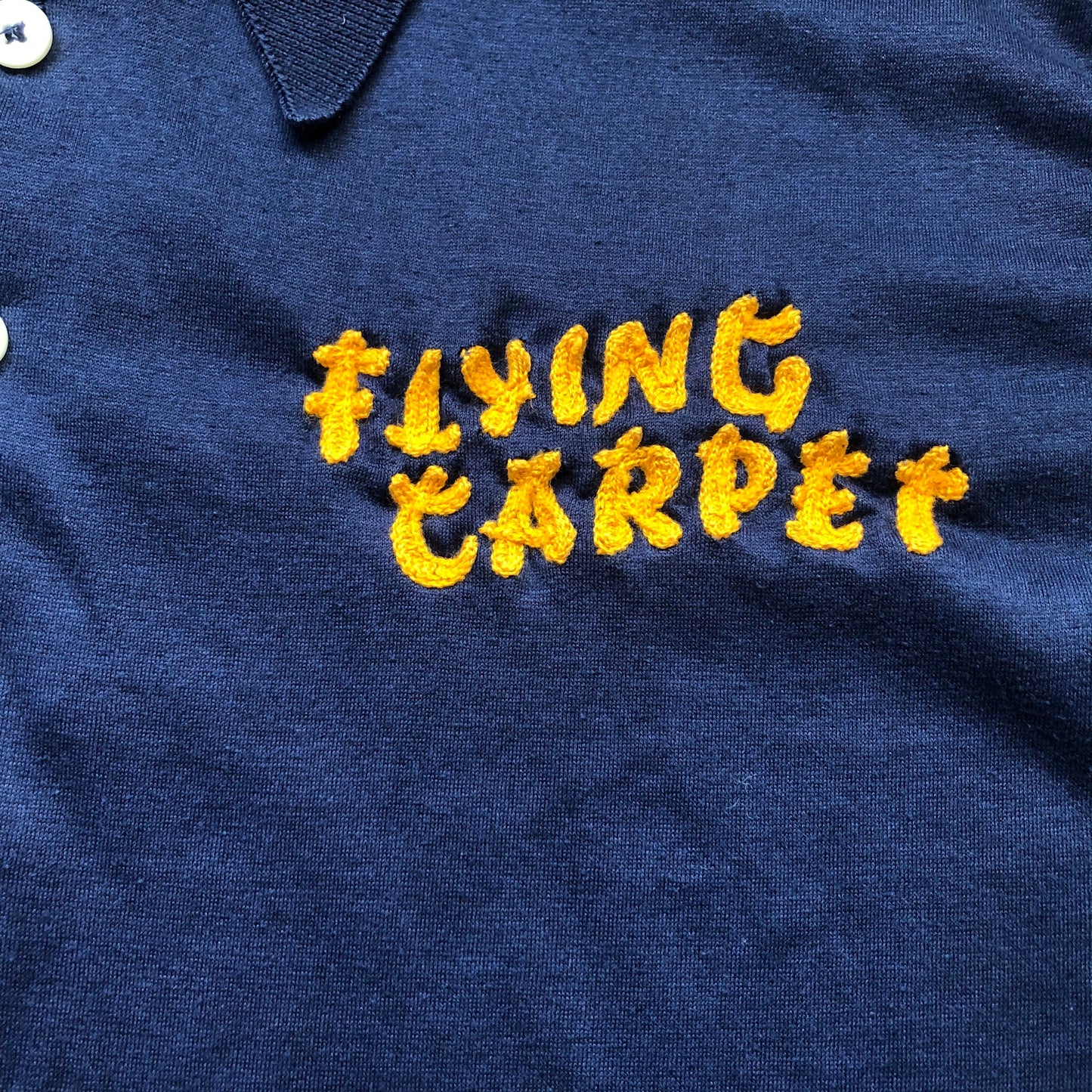 Vintage Unisex Embroidered Flying Carpet Four Buttoned Polo | Possibly Flying Carpet Motor Inn