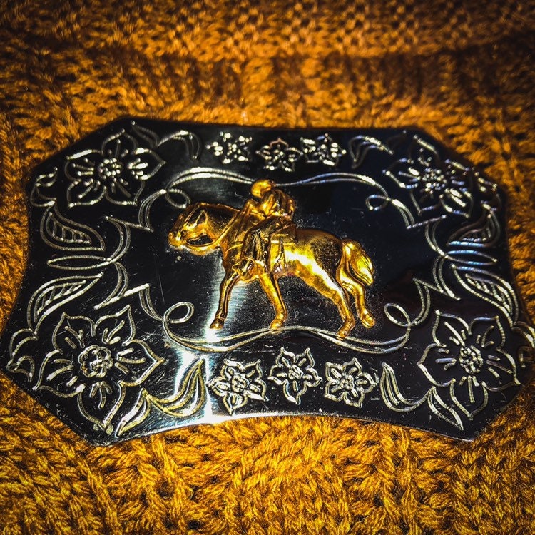 Vintage Western Sand & Sage Nickle and Silver Buckle with a Cowboy Riding a Horse and Floral Etching